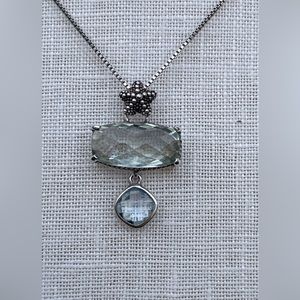 Beautiful sterling silver necklace set with amethyst and blue topaz